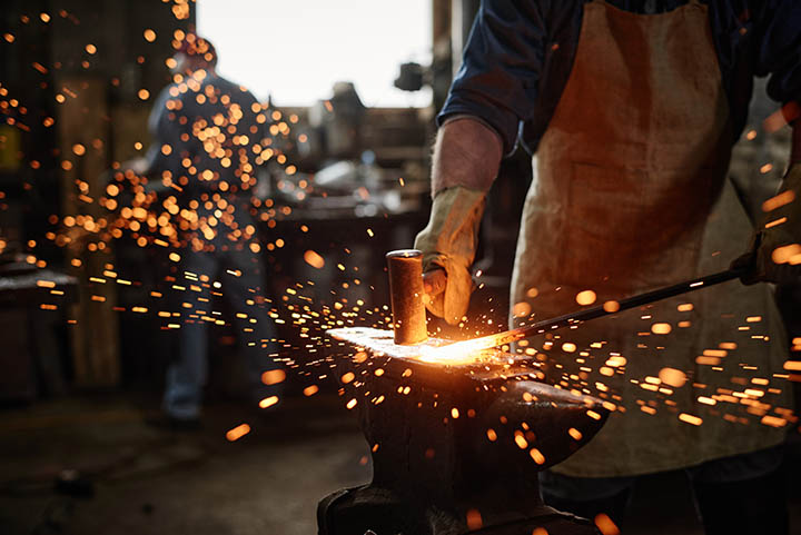 Blacksmith working in the workshop